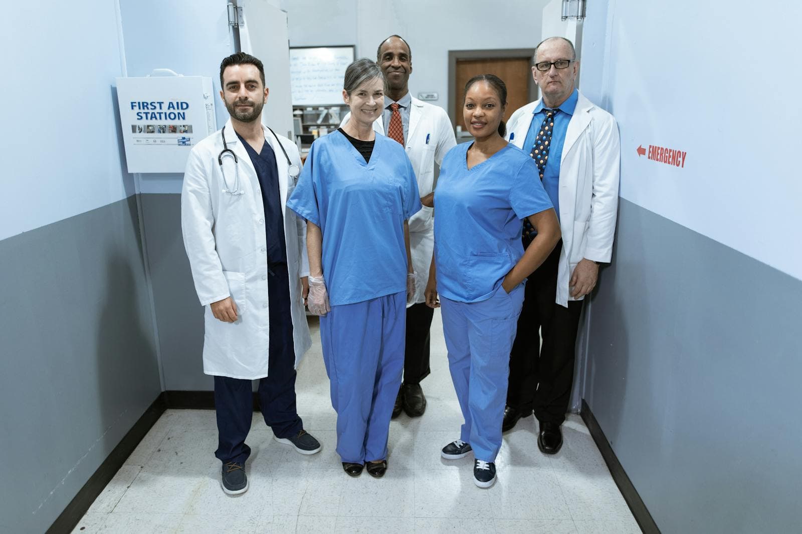Healthcare facility team in a hospital corridor.