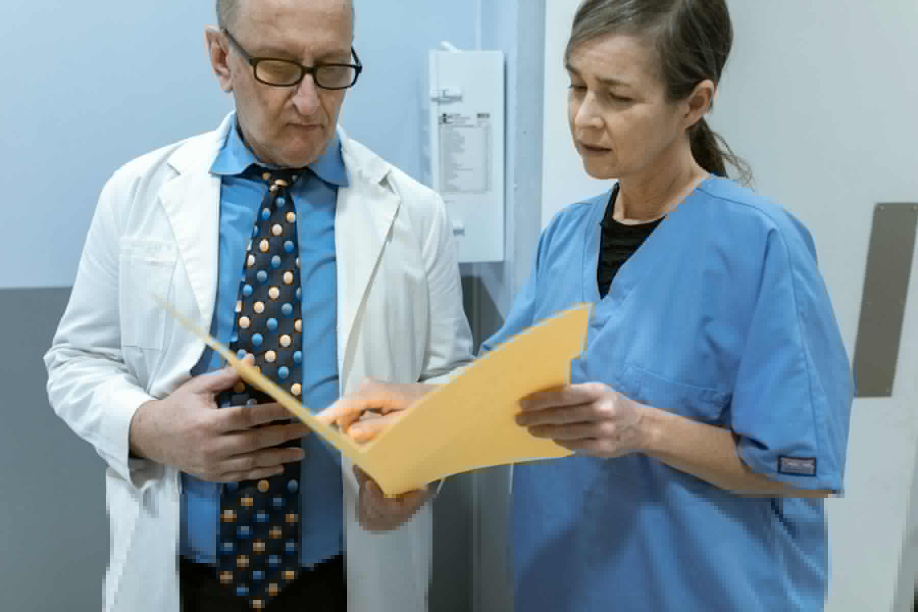 Healthcare professional reviewing clinical records.