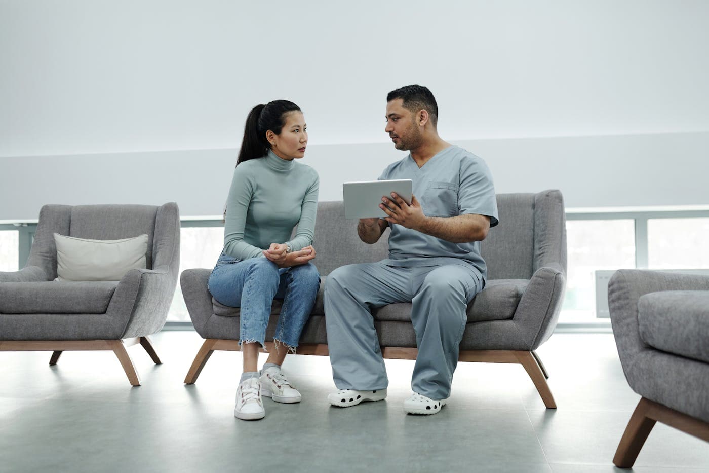 Healthcare professional consulting in a clinic.