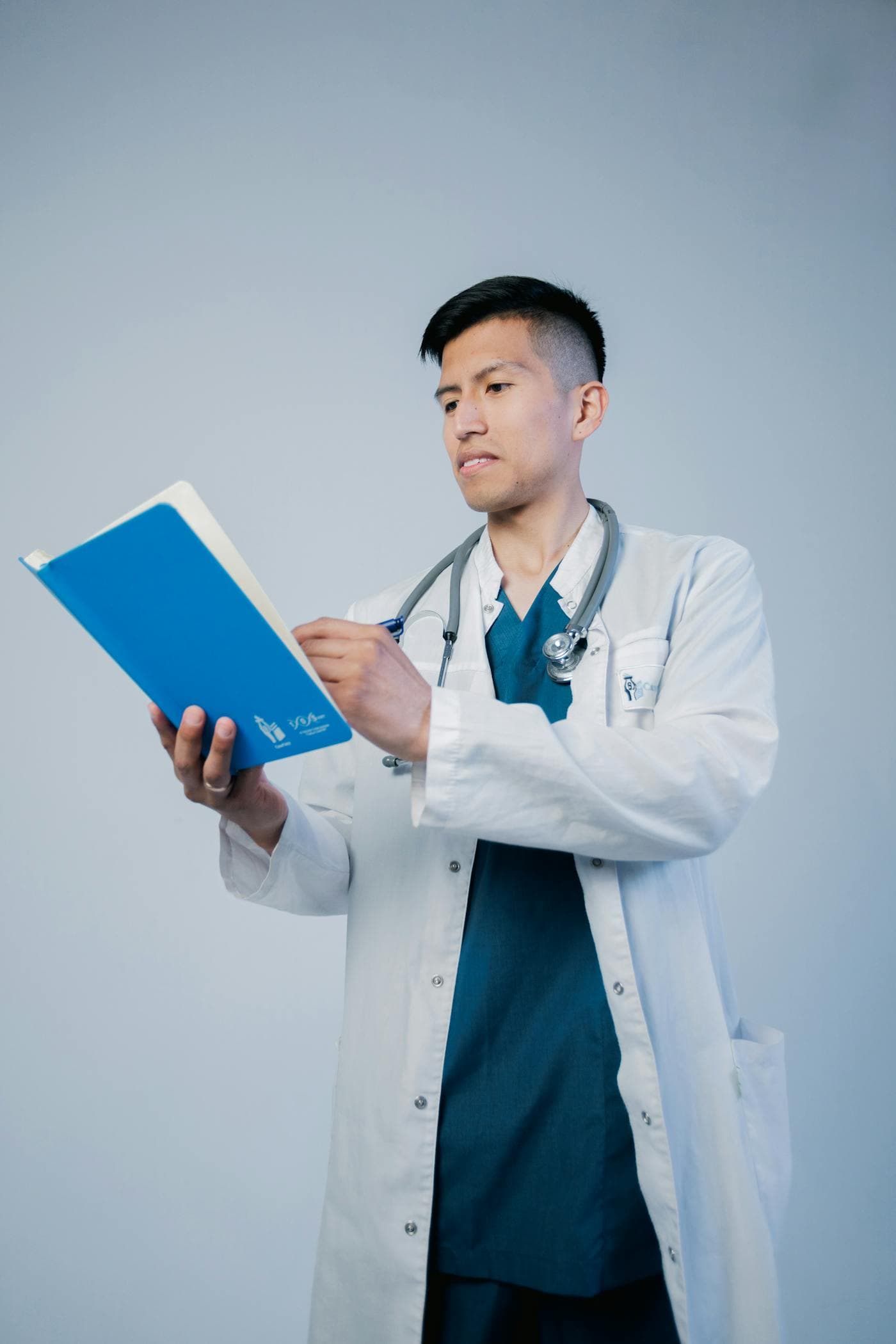 Credential verification desk with healthcare records under review.